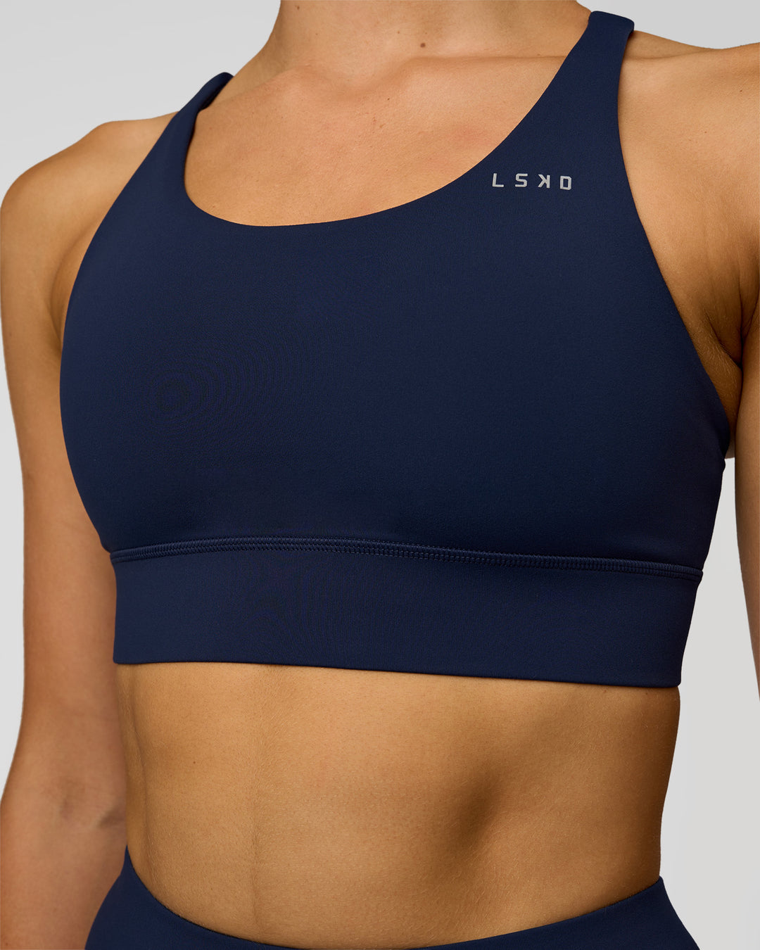 Woman wearing Accelerate Sports Bra - Future Navy | Model:Evie | Size:S