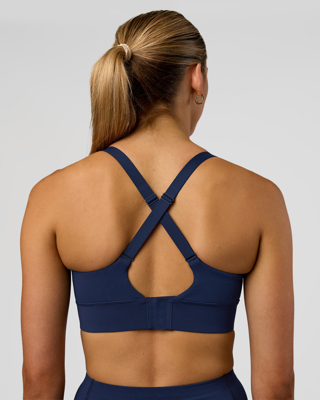 Woman wearing Accelerate Sports Bra - Future Navy | Model:Evie | Size:S
