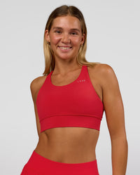 Woman wearing Accelerate Sports Bra - Scarlet | Set:true | Angle:front | Model:Amity | Size:S