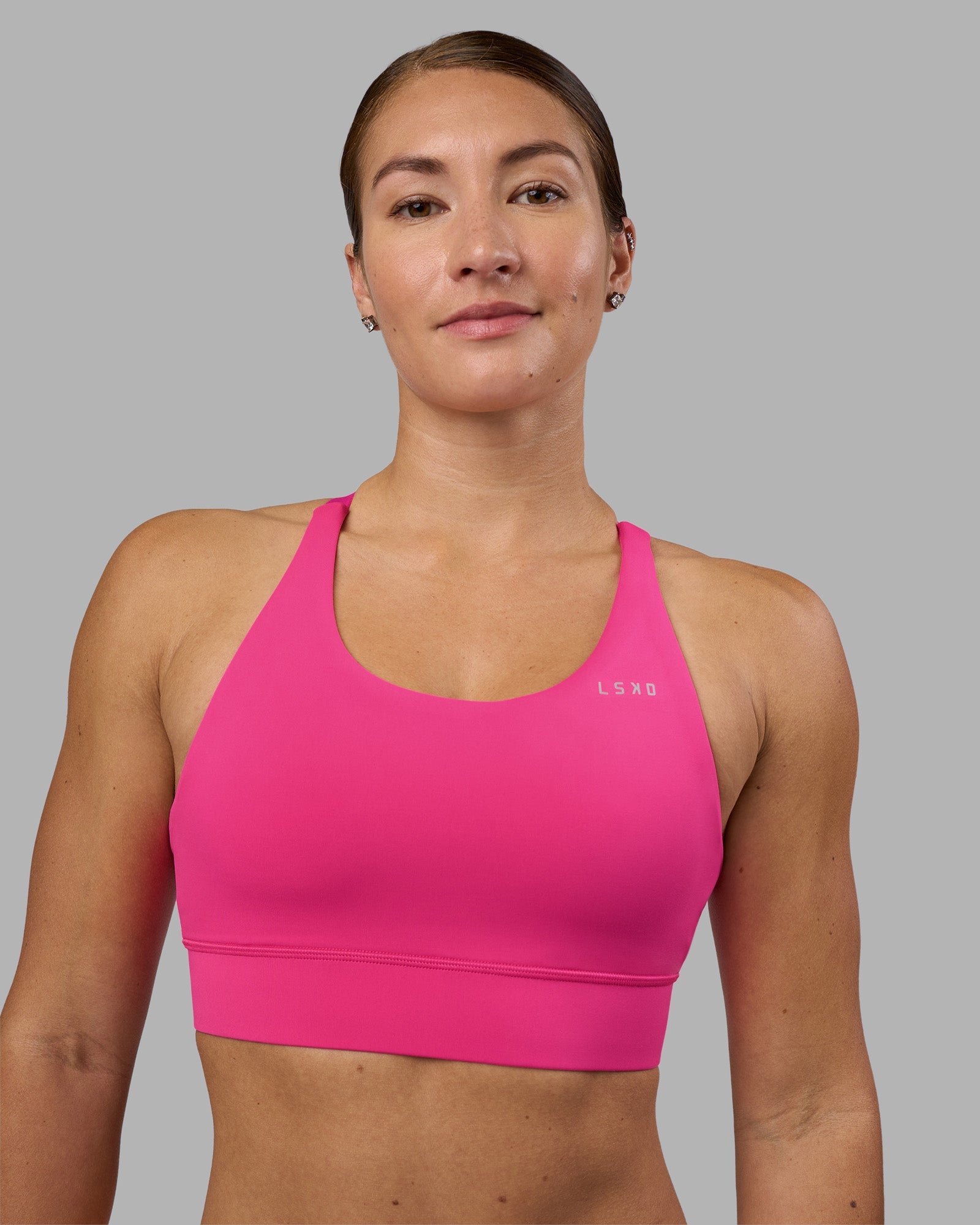 Woman wearing Accelerate Sports Bra - Ultra Pink | Model:Hannah | Size:S