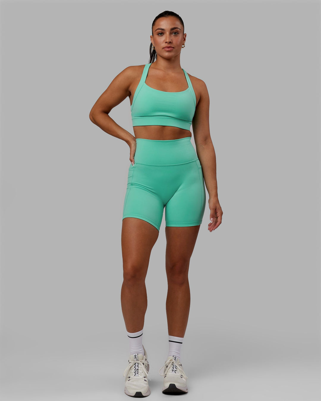 Woman wearing Advance Sports Bra - Aquatic Awe