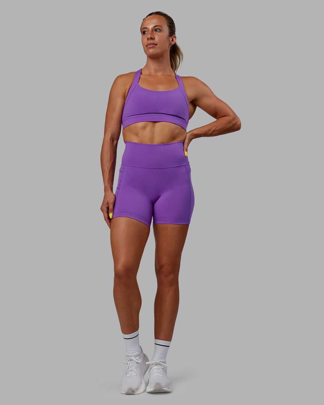 Woman wearing Advance Sports Bra - Purple Swirl