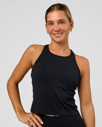 Woman wearing AeroFLX+ Seamless Flow Skimmer Tank - Black Marl | Model:Amity | Size:S