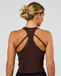 Woman wearing AeroFLX+ Seamless Flow Skimmer Tank - Hot Chocolate/Hot Chocolate | Model:Amity | Size:S