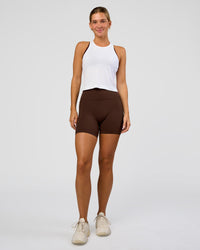Woman wearing AeroFLX+ Seamless Flow Skimmer Tank - White/White | Model:Amity | Size:S | Thumbnail Index: 3