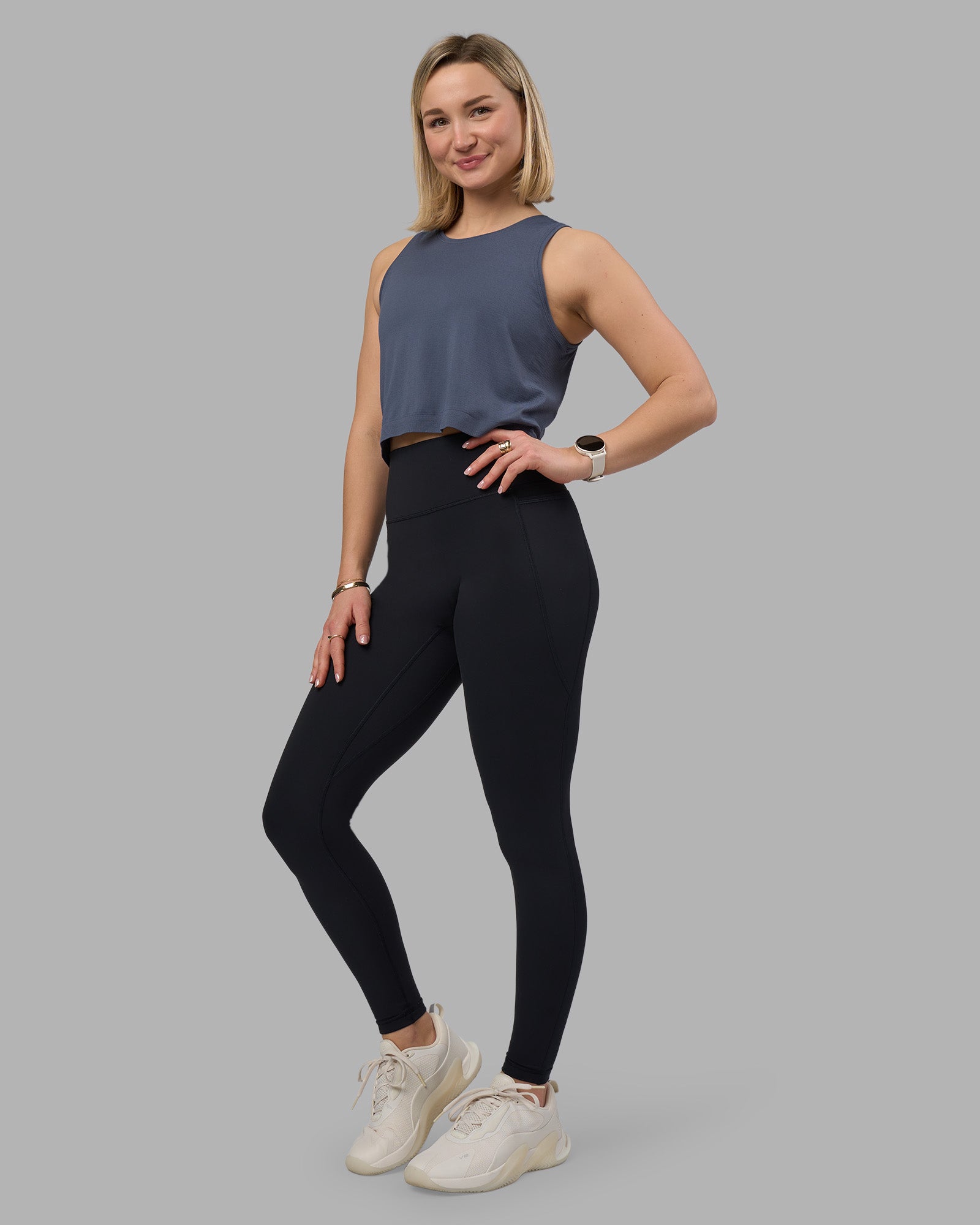 Woman wearing AeroFLX+ Seamless Skimmer Tank - Night Shadow/Night Shadow | Model:Halle | Size:S