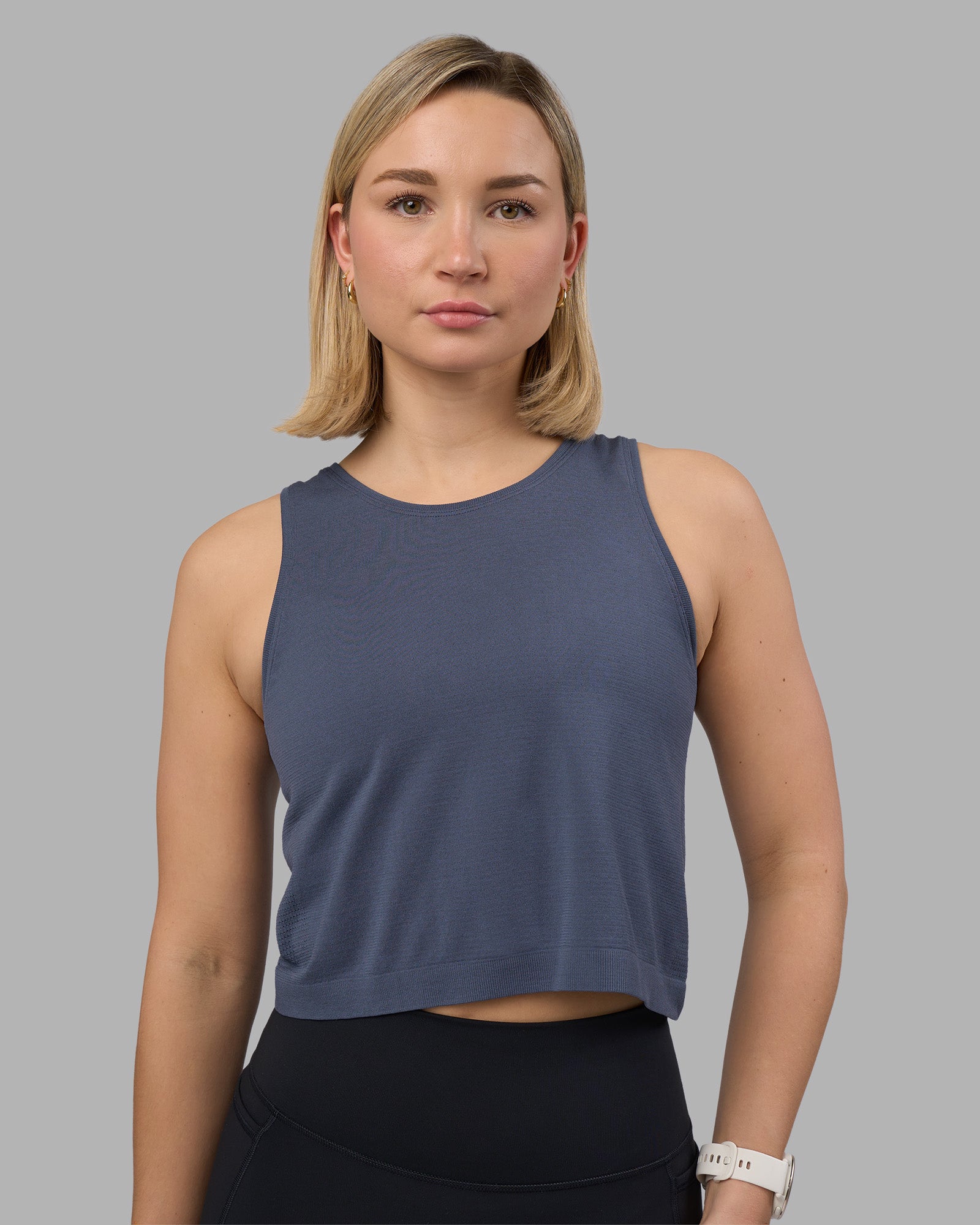 Woman wearing AeroFLX+ Seamless Skimmer Tank - Night Shadow/Night Shadow | Model:Halle | Size:S