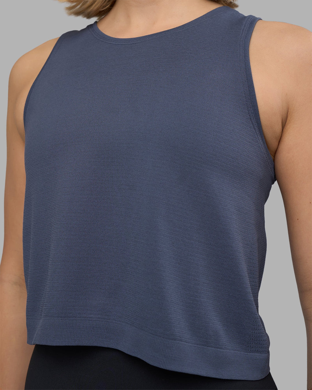 Woman wearing AeroFLX+ Seamless Skimmer Tank - Night Shadow/Night Shadow | Model:Halle | Size:S