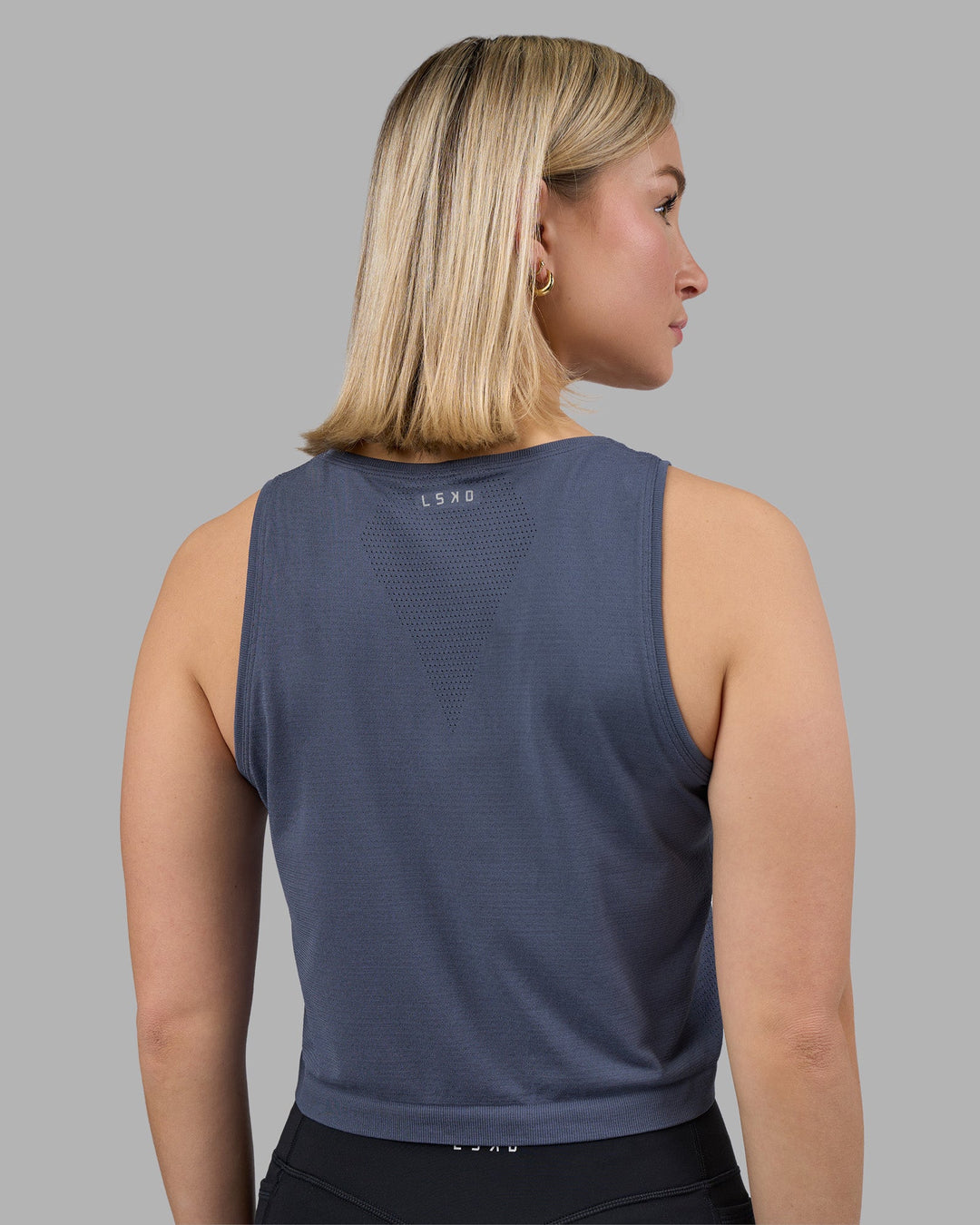 Woman wearing AeroFLX+ Seamless Skimmer Tank - Night Shadow/Night Shadow | Model:Halle | Size:S