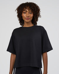 Woman wearing AfterDark ZeroCrease Cropped Tee - Black | Model:Tomi | Size:S