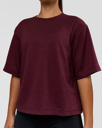 Woman wearing AfterDark ZeroCrease Cropped Tee - Cherry Lacquer | Model:Sophia | Size:S