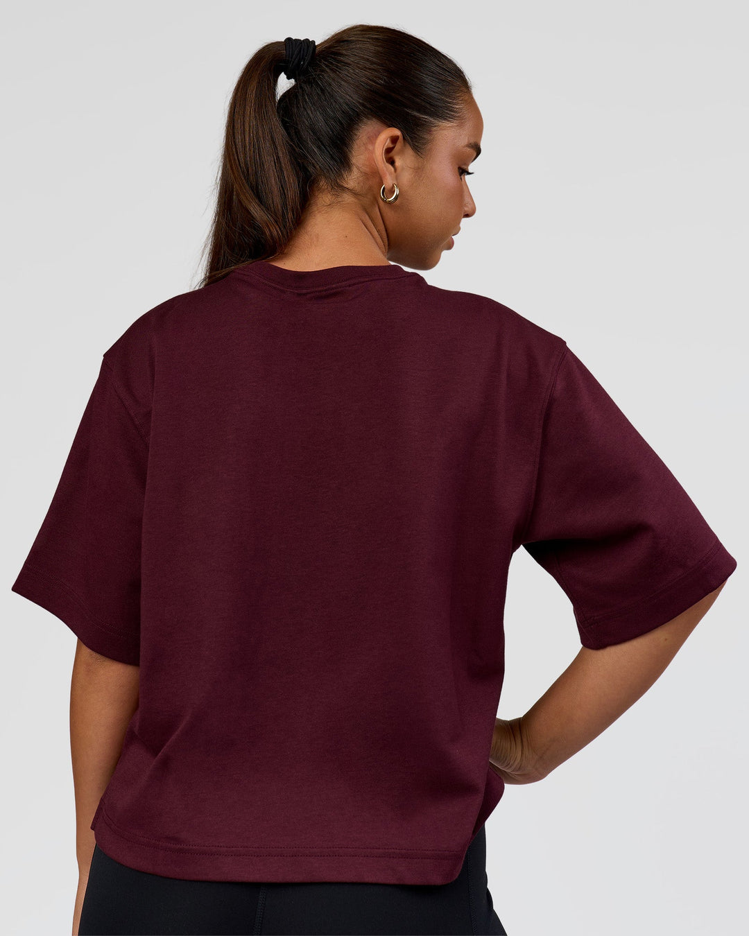 Woman wearing AfterDark ZeroCrease Cropped Tee - Cherry Lacquer | Model:Sophia | Size:S