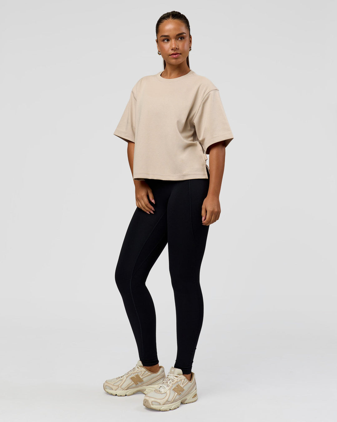 Woman wearing AfterDark ZeroCrease Cropped Tee - Shale Beige | Model:Sophia | Size:S