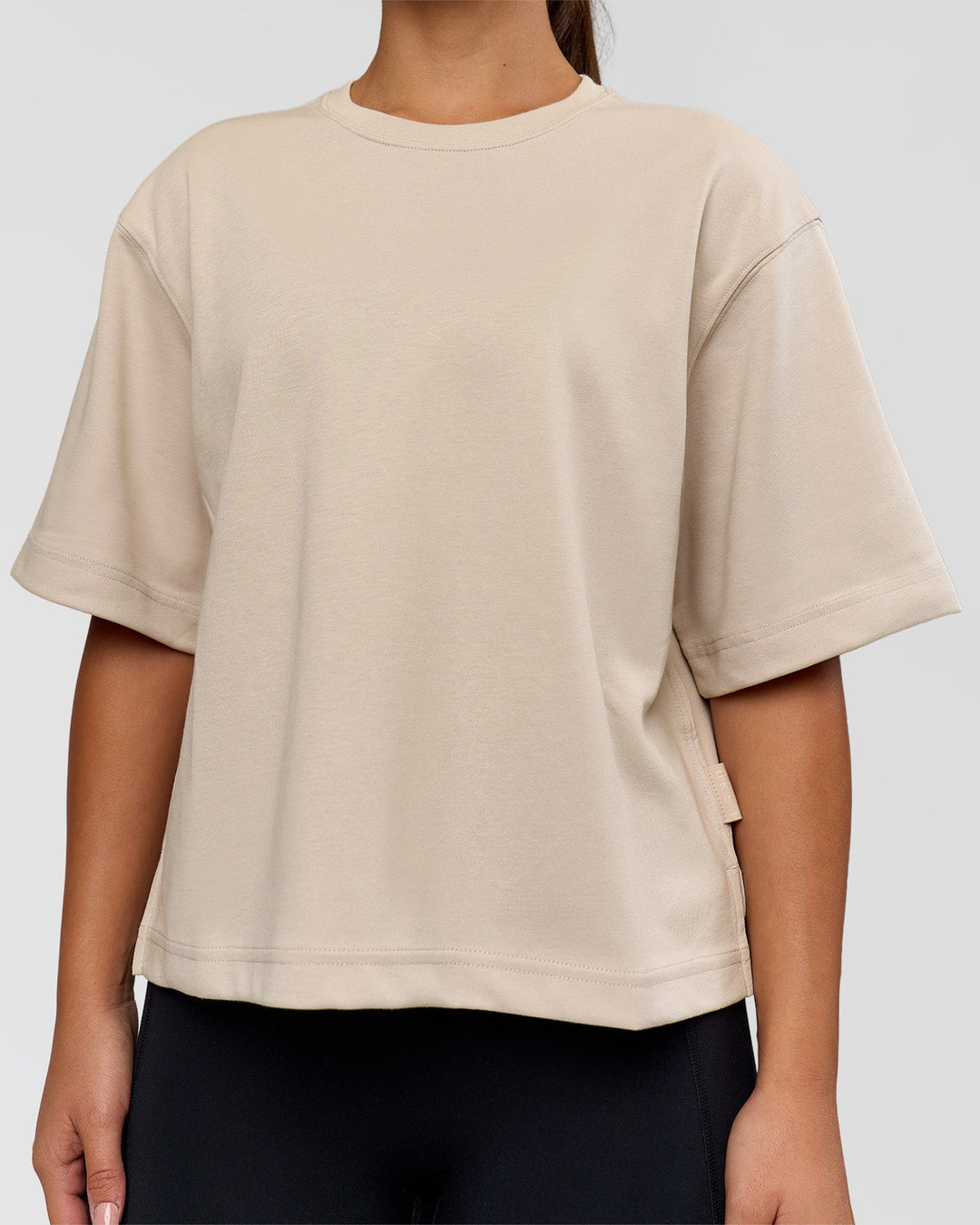 Woman wearing AfterDark ZeroCrease Cropped Tee - Shale Beige | Model:Sophia | Size:S