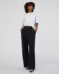 Woman wearing AfterDark ZeroCrease Cropped Tee - White | Model:Tomi | Size:S