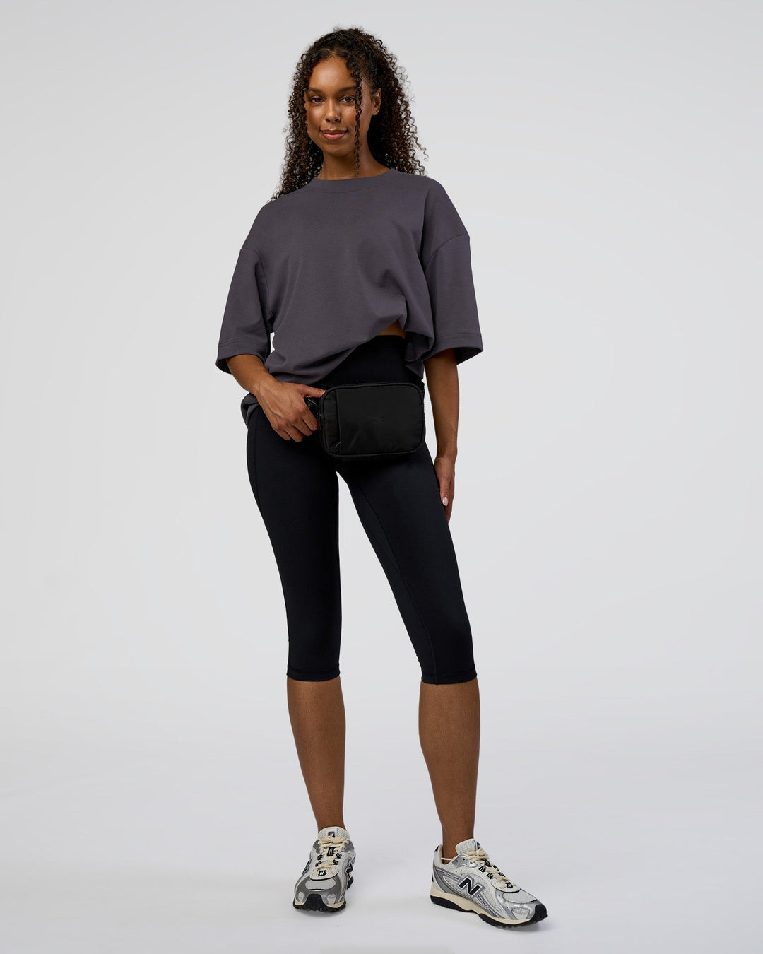 Woman wearing AfterDark ZeroCrease Oversized Tee - Dark Storm | Model:Jordan | Size:S