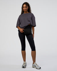 Woman wearing AfterDark ZeroCrease Oversized Tee - Dark Storm | Model:Jordan | Size:S