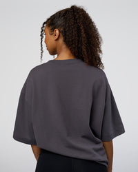 Woman wearing AfterDark ZeroCrease Oversized Tee - Dark Storm | Model:Jordan | Size:S