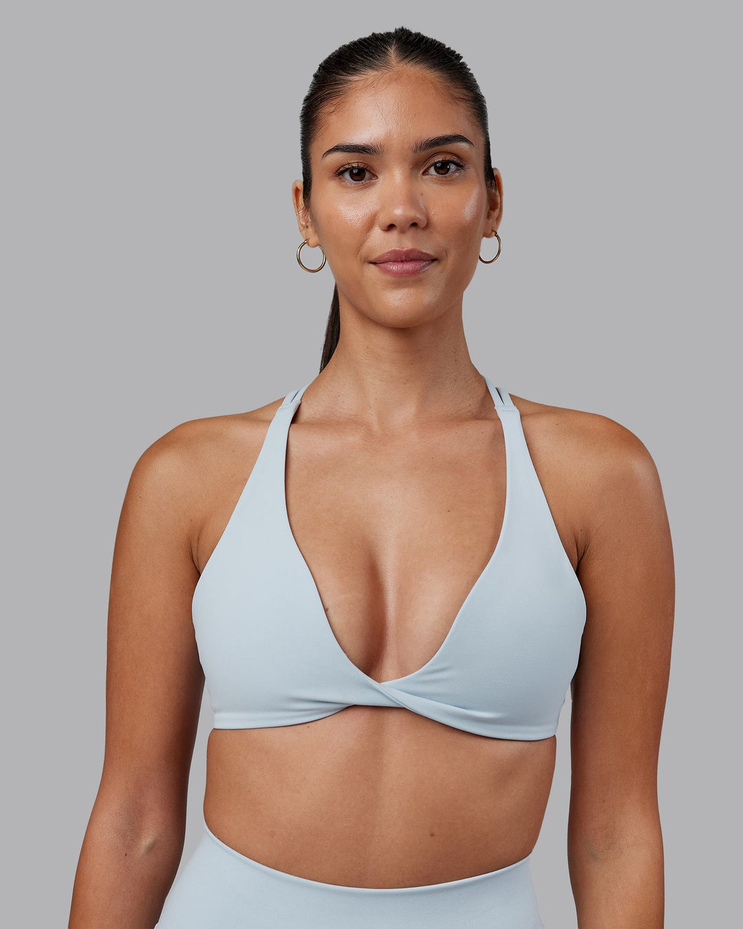 Woman wearing Agile Sports Bra - Skyride | Model:Rhiley | Size:S