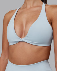 Woman wearing Agile Sports Bra - Skyride | Model:Rhiley | Size:S