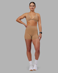 Woman wearing Agile Sports Bra - Warm Smoke | Model:Keisha | Size:S