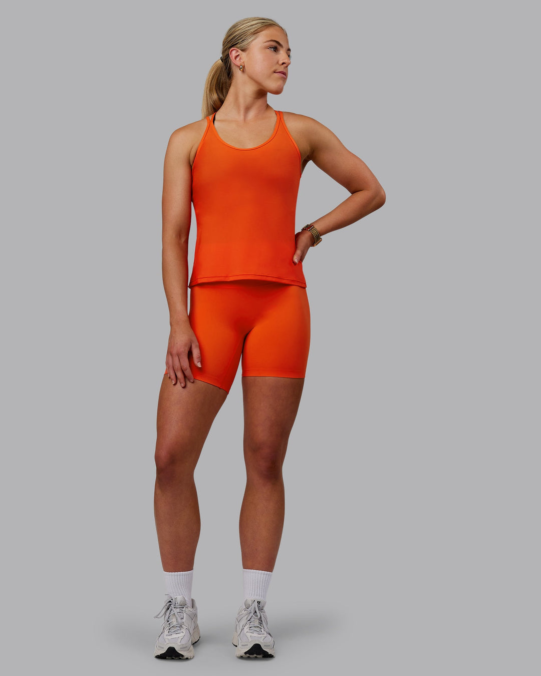 Woman wearing Apex Lightweight Performance Tank - Grenadine