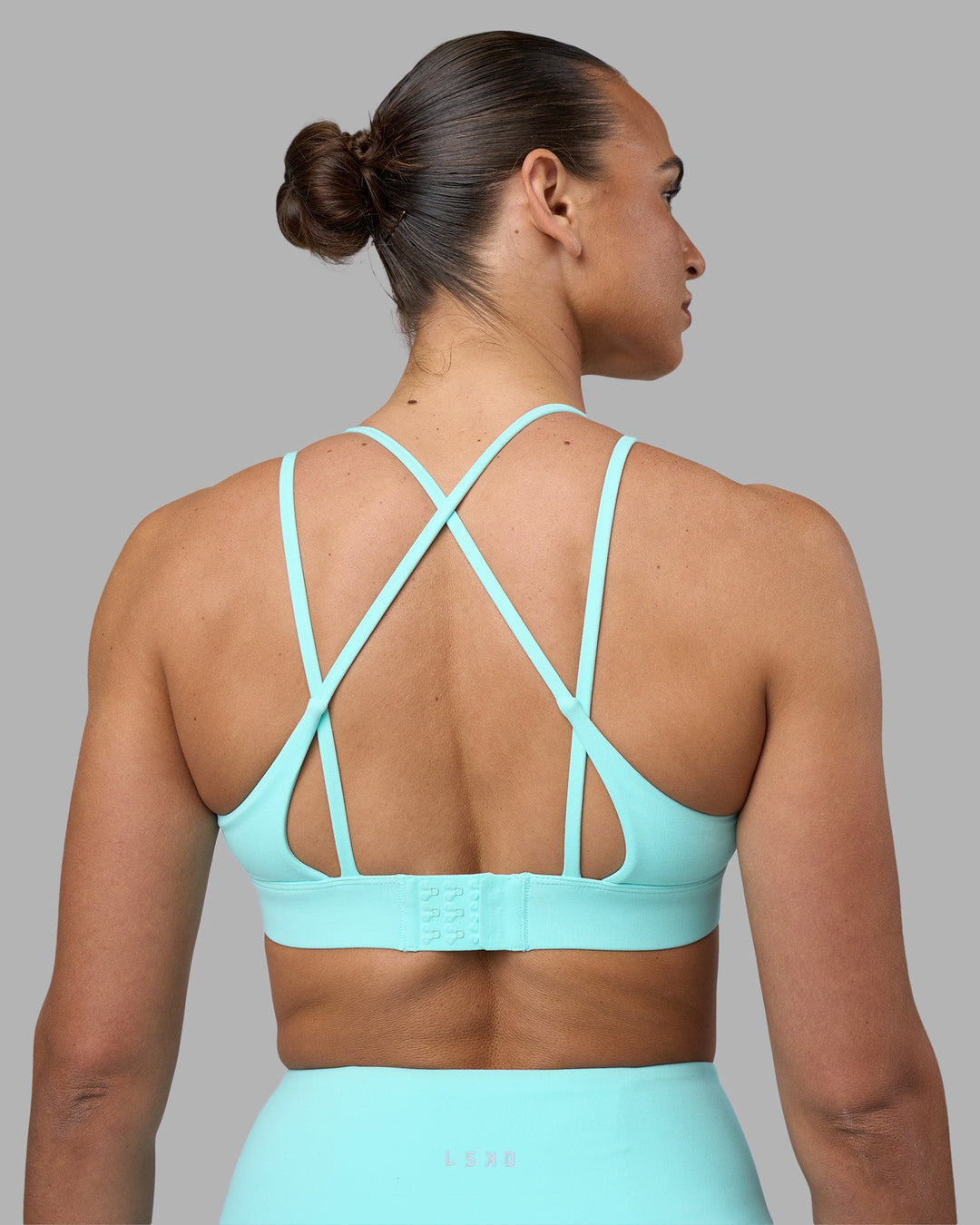 Woman wearing Aria Triangle Sports Bra - Island Paradise | Model:Sophie | Size:S