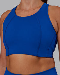 Woman wearing Ascent Sports Bra - Blue Quartz | Model:Phoebe | Size:S