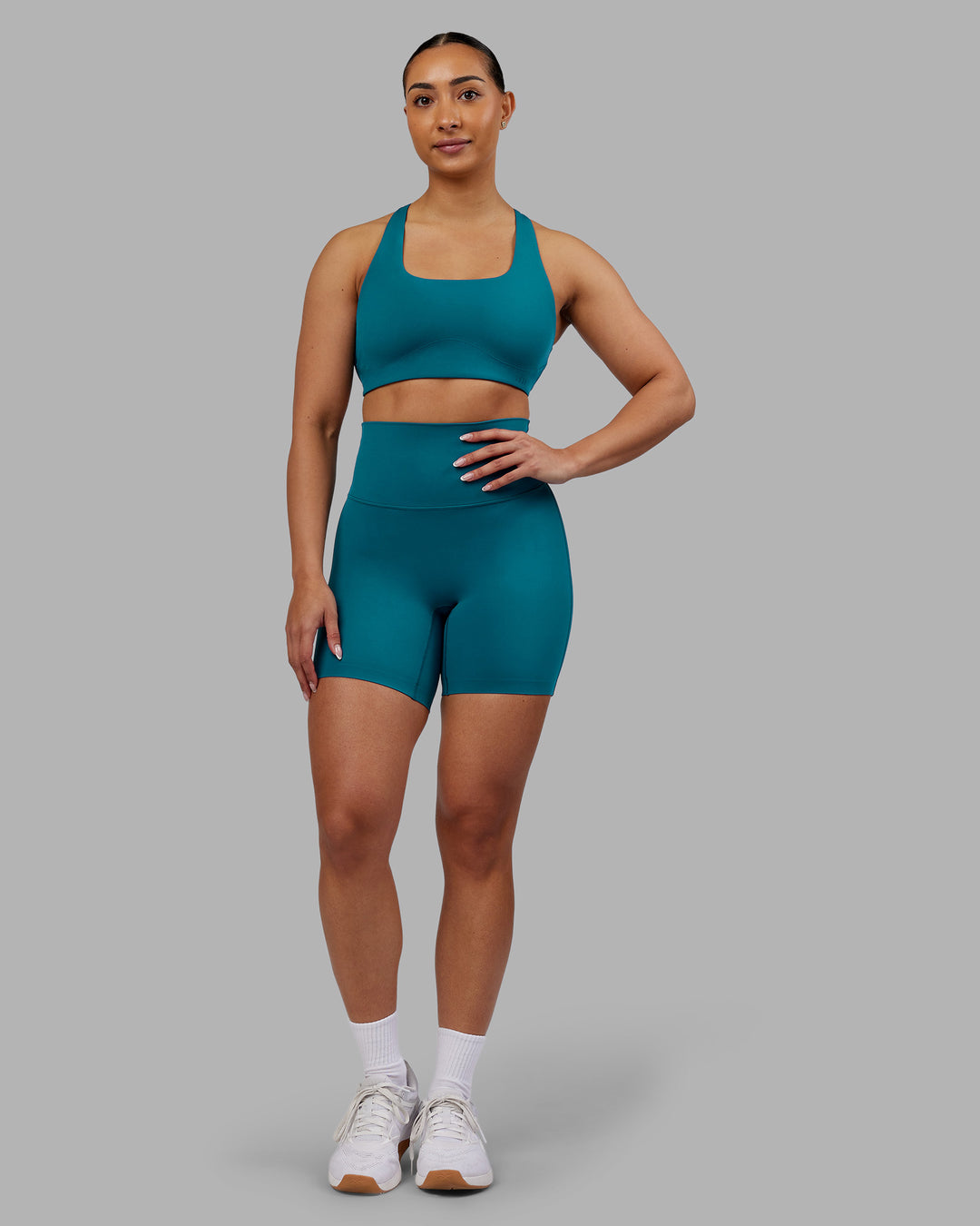 Woman wearing Aspire Sports Bra - Blue Coral | Model:Ayla| Size:S