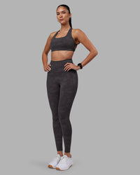 Woman wearing Aspire Sports Bra - Dark Storm Wash | Model:Rhiley | Size:S