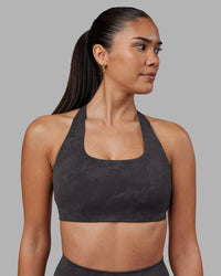 Woman wearing Aspire Sports Bra - Dark Storm Wash | Model:Rhiley | Size:S | Thumbnail Index: 1
