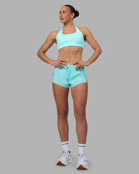 Woman wearing Aspire Sports Bra - Island Paradise | Model:Sophie | Size:S
