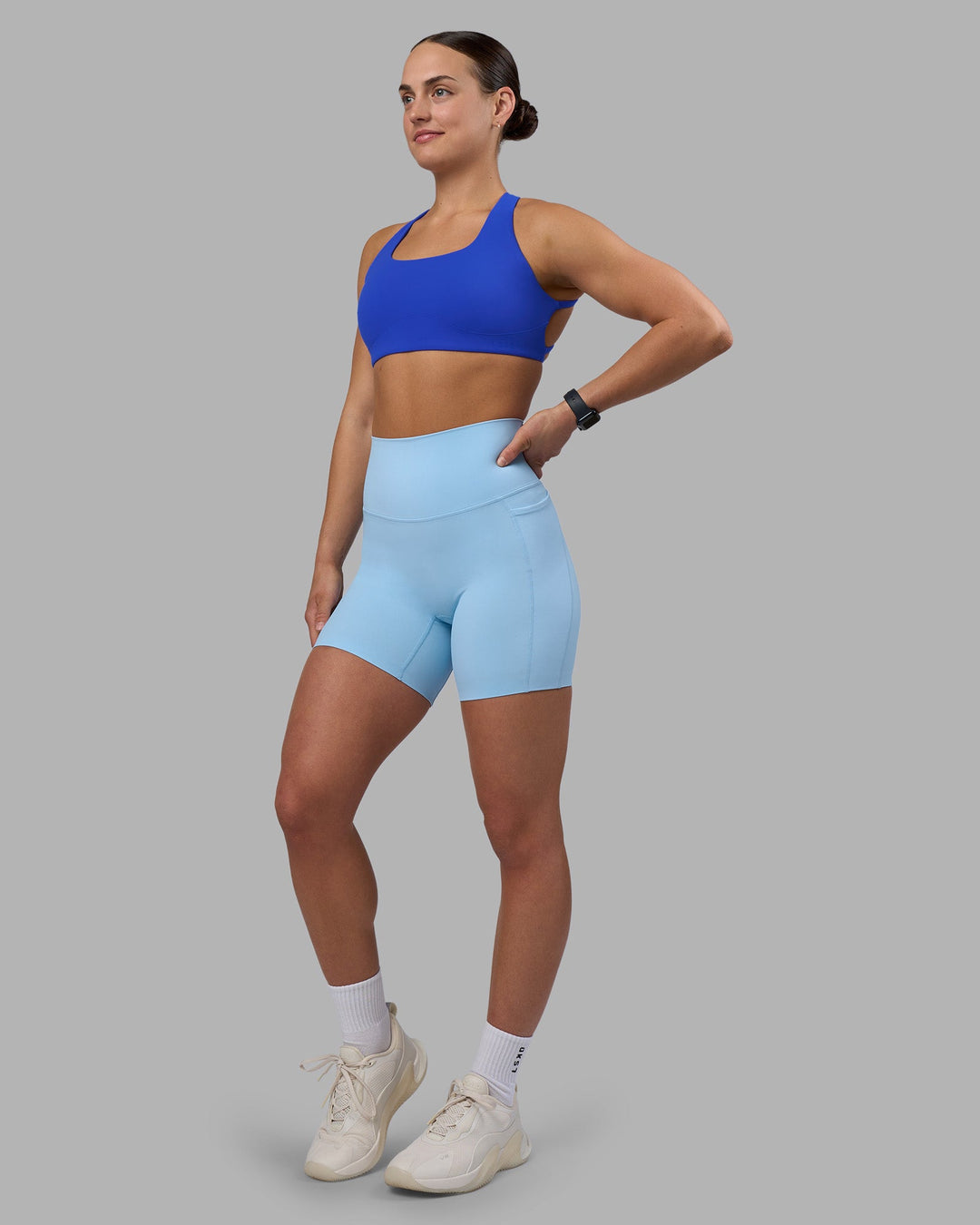 Woman wearing Aspire Sports Bra - Power Cobalt | Model:Keisha | Size:S