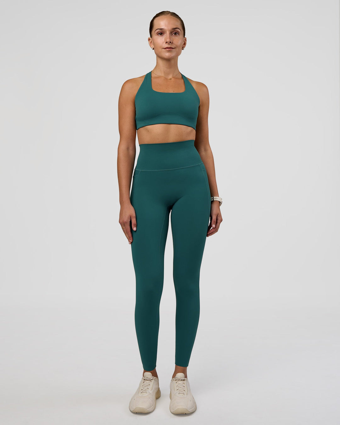 Woman wearing Aspire Sports Bra - Transformative Teal | Model:Myrte | Size:S