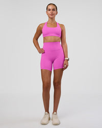Woman wearing Aspire Sports Bra - Ultra Fuchsia | Model:Myrte | SIze:S