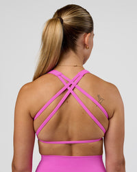 Woman wearing Aspire Sports Bra - Ultra Fuchsia | Model:Myrte | SIze:S