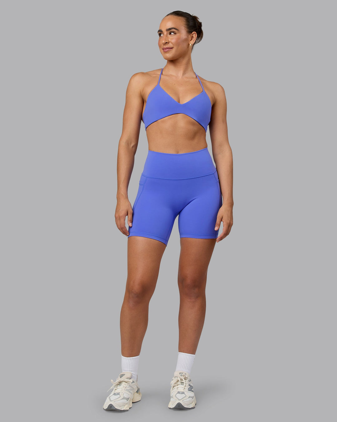 Woman wearing Aura Sports Bra - Baja Blue