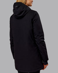 Woman wearing Auxiliary 2.0 Jacket - Black | Model:Ella | Size:S