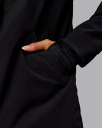 Woman wearing Auxiliary 2.0 Jacket - Black | Model:Ella | Size:S