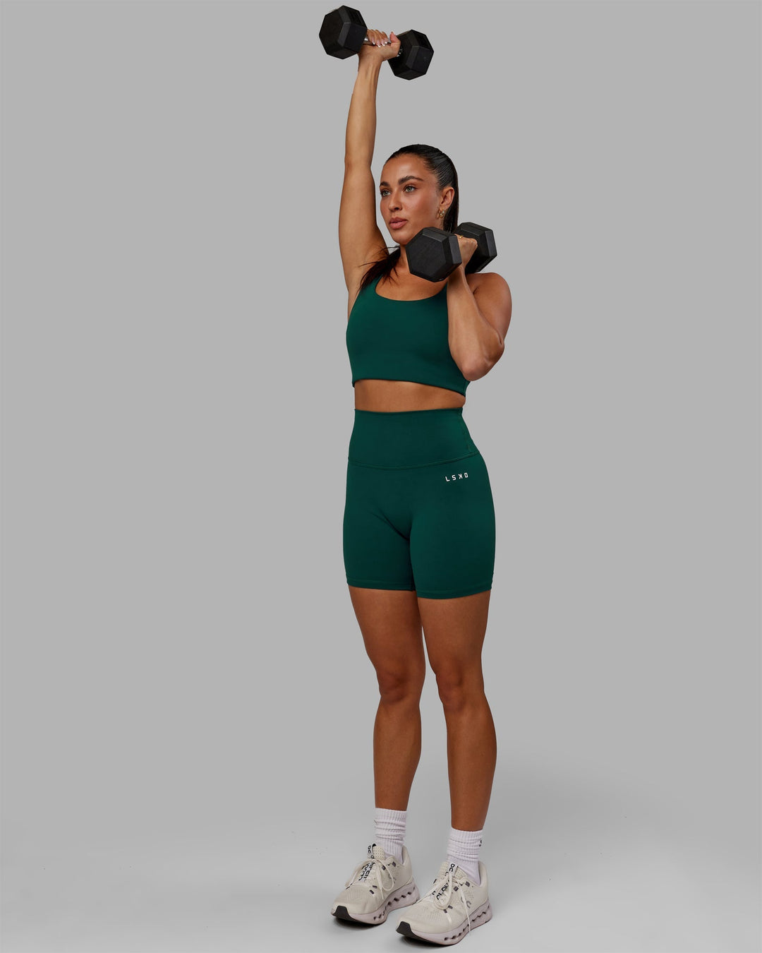 Woman wearing Base 2.0 Ultra High-Rise 6" Short - Dark Moss