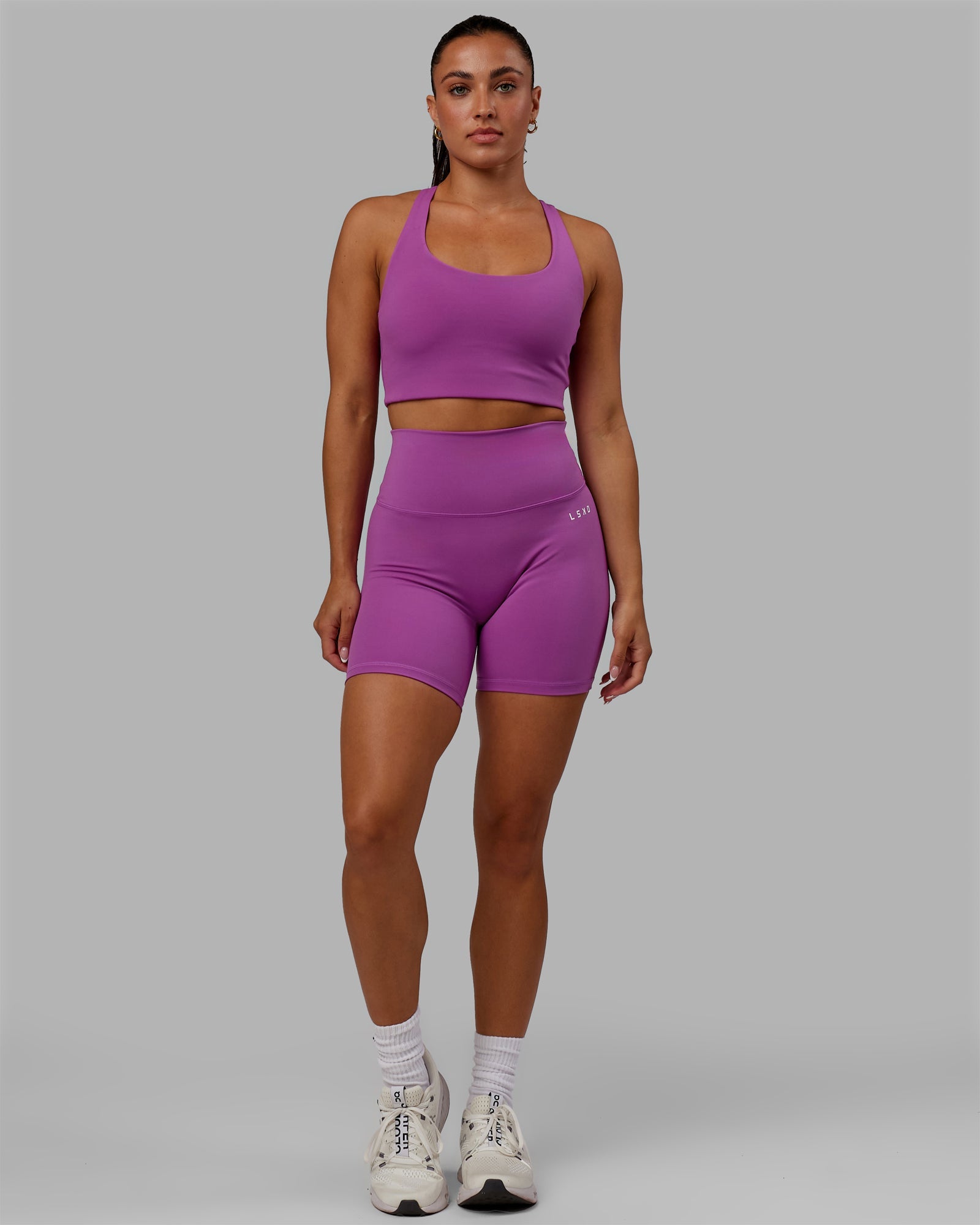 Woman wearing Base 2.0 Ultra High-Rise 6" Short - Hyper Violet