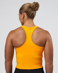 Woman wearing Be Bold Performance Tank - Zinnia | Model:Tenaya | Size:S