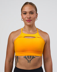 Woman wearing Be Bold Sports Bra - Zinnia | Model:Tenaya | Size:S
