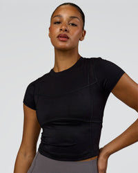 Woman wearing Bend Performance Tee - Black | Model:Rosie | Size:S