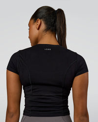 Woman wearing Bend Performance Tee - Black | Model:Rosie | Size:S