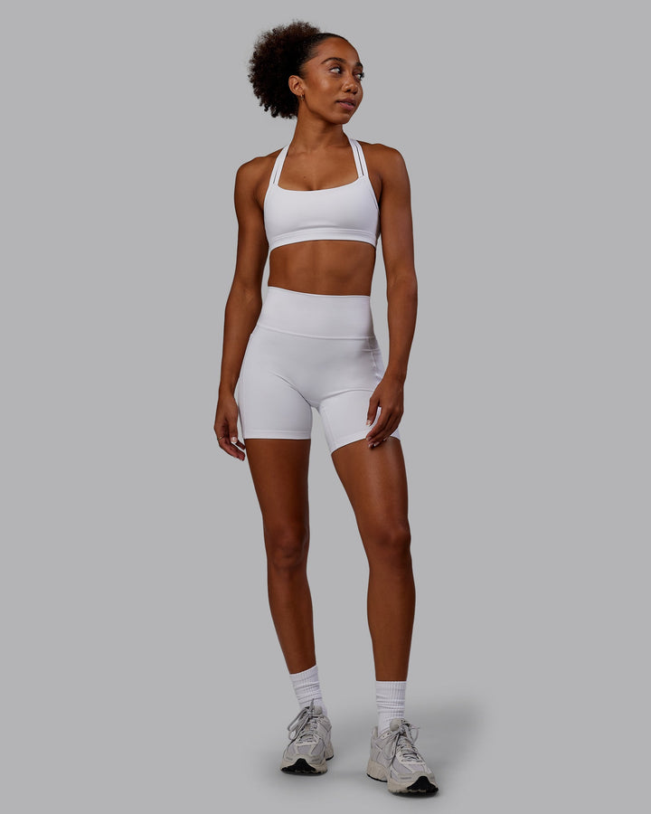 Woman wearing Bree Masters Velocity Sports Bra - White
