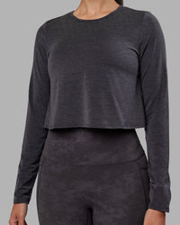 Woman wearing Breeze Long Sleeve Training Tee - Black | Model:Rhiley | Size:S