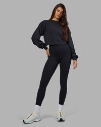 Woman wearing Breeze Open Back Sweater - Black-Black | Model:Phoebe | Size:S