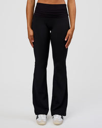 Woman wearing CF Fold Over High-Rise Flared Legging Tall - Black | Model:Rosie | Size:S