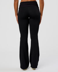 Woman wearing CF Fold Over High-Rise Flared Legging Tall - Black | Model:Rosie | Size:S
